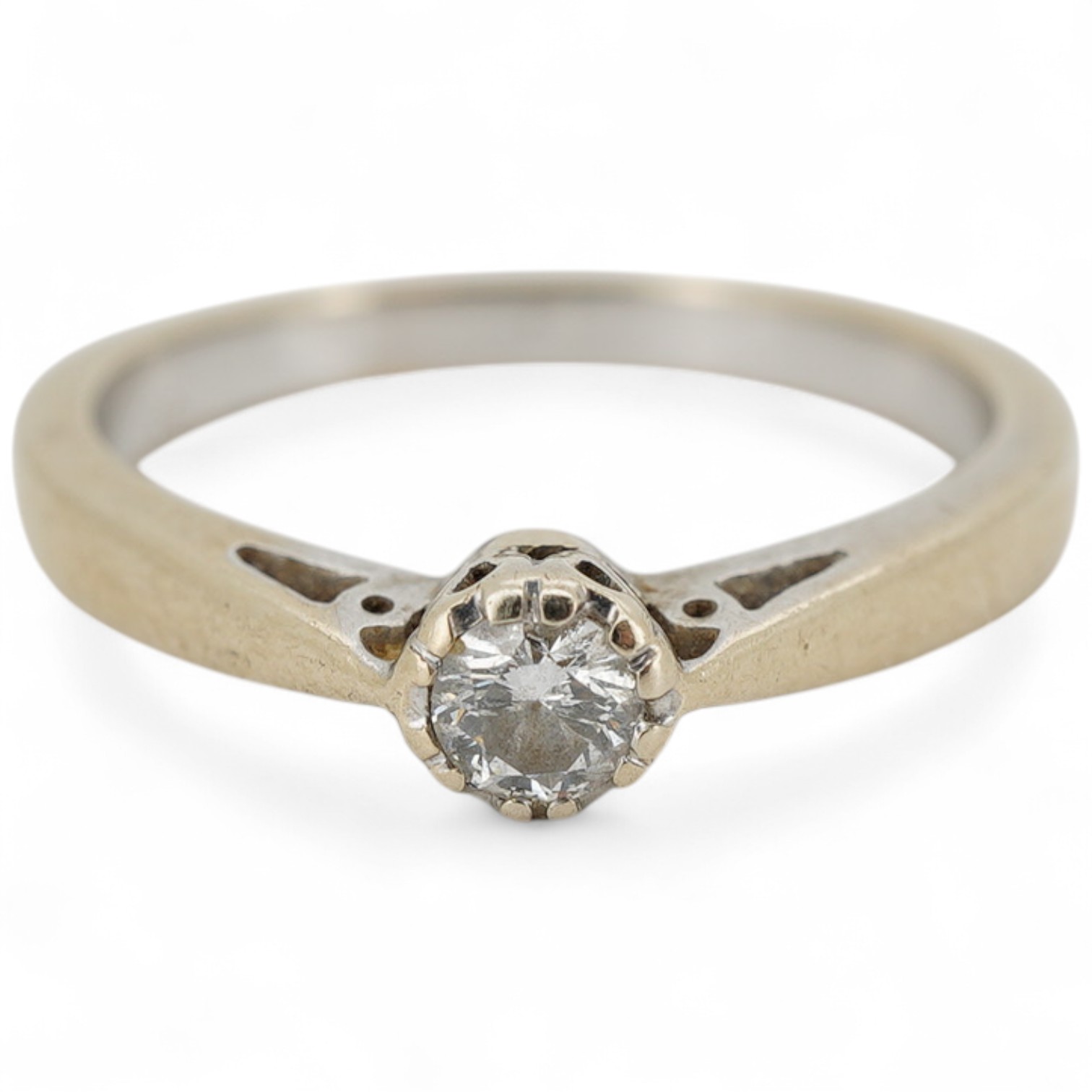 A diamond solitaire ring, claw-set with a brilliant-cut diamond weighing approximately 0.15 carats, mounted in 18ct gold, size N, British hallmarks, gross weight approximately 3 grams